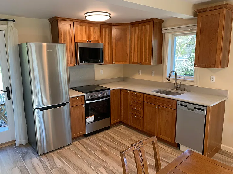 Kitchen with dishwasher, disposal, electric stove
