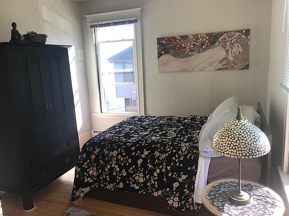 Bedroom with maple hardwood floors with spacious double closet