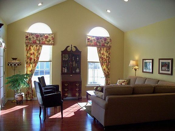 Living Room w/ Cathedral Ceiling and Hardwood Floor