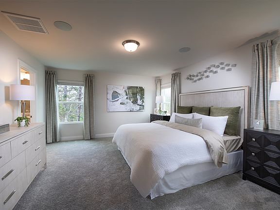 The primary suite offers the perfect place to unwind after a long day.