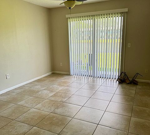 Den with patio and lake view.
