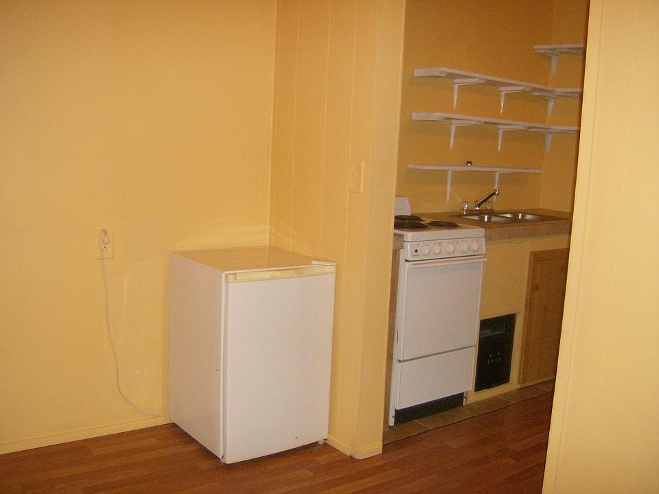 Bedroom looking into kitchen
