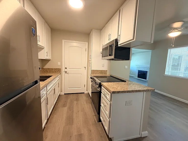 Kitchen and dining area from hallway.