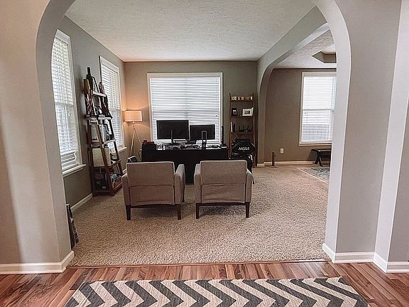 Den/Parlor with arched entry