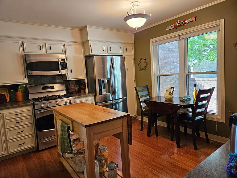 Spacious kitchen with views. Bamboo floor, gas stove.