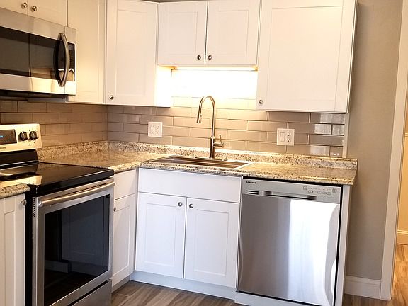 Kitchen with newer stainless appliances and newer cabinets