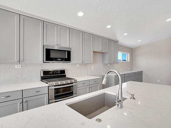 Gas in kitchen. Photo representing home to be built and may demonstrate optional features