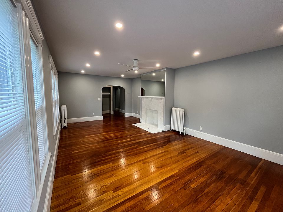 Large living room with new recessed lights and ceiling fan