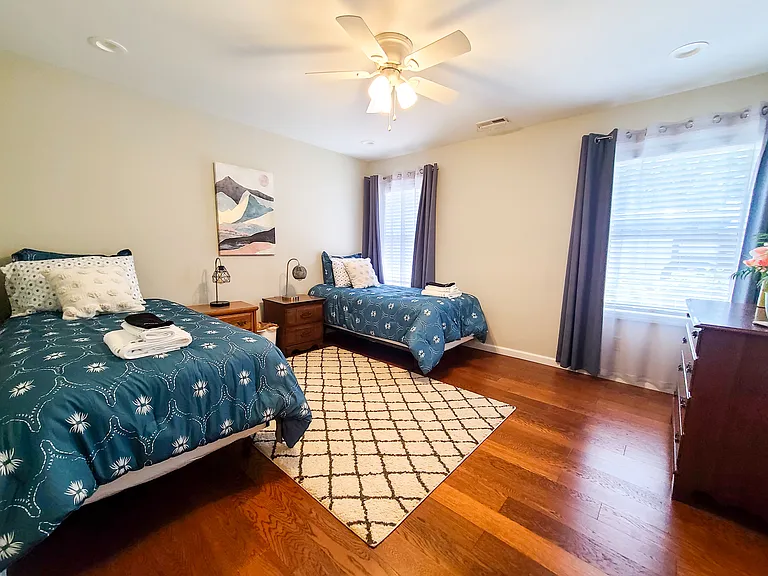 Bedroom 2/4 - Large bedrooms with large, bright windows and multiple lighting options with a fan.