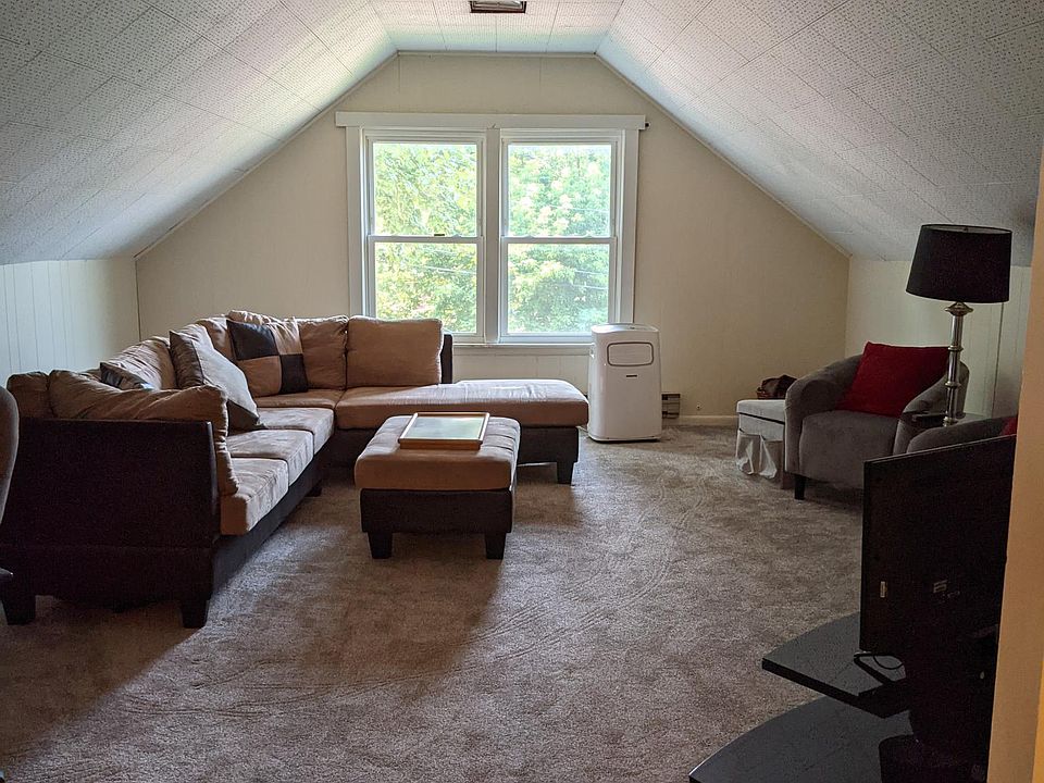 Large living room with great natural light and new carpet