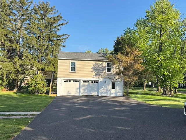 Updated apartment above garage includes 1 bay garage and laundry facilities with washer and dryer.