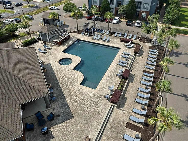 Resort-Style Pool with Hot Tub and Lounge Chairs at Eagle Flatts Apartments, Hattiesburg, MS