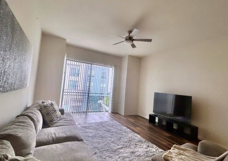 Equipped with a comfortable oversized couch and 65" tv