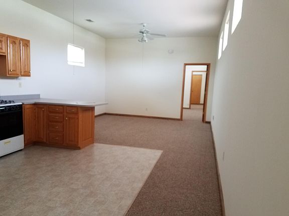 Living area with ceiling fan.