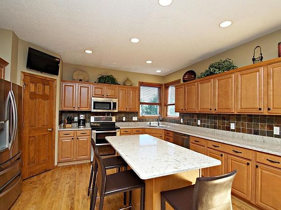 Loads of cabinets, dual pantry, Cambria counter tops and stainless steel appliances.