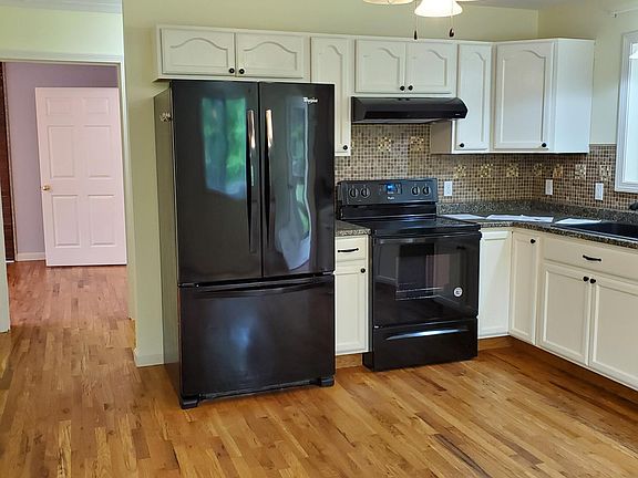 Kitchen looking into bedroom