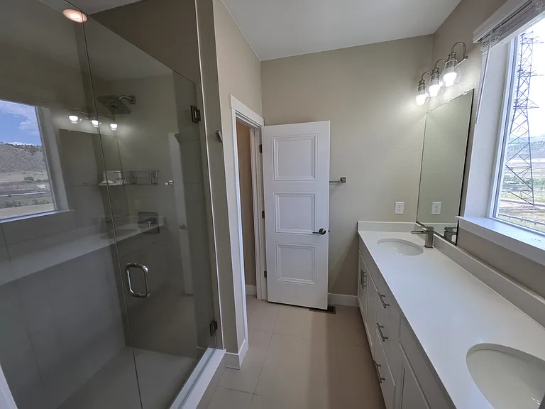 Master bath with double vanity and walk in shower