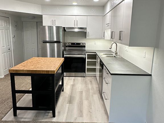 Brand new open kitchen with island / eating area. Stainless steel appliances.