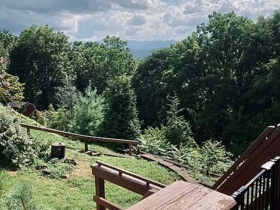 Terraced yard is partially fenced.