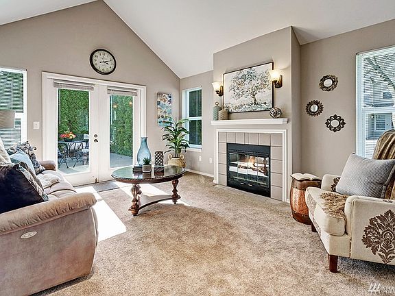 Bright & Cozy Family Room w/Gas Fireplace, which opens to Private Patio 