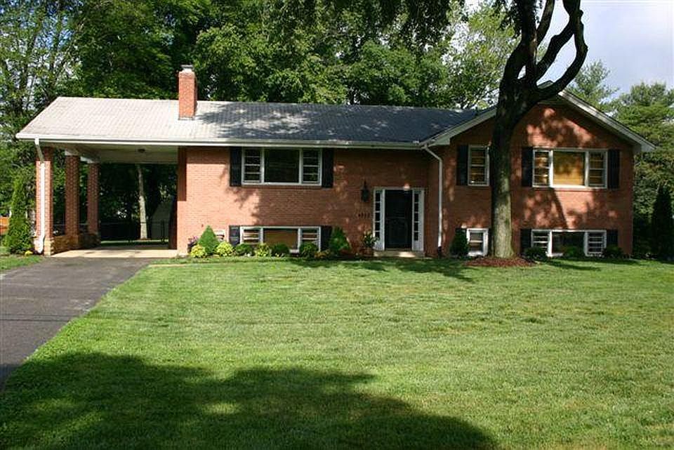 Large flat 1/2 acre lot with long driveway