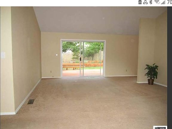 Living room from front door looking out slider to back deck