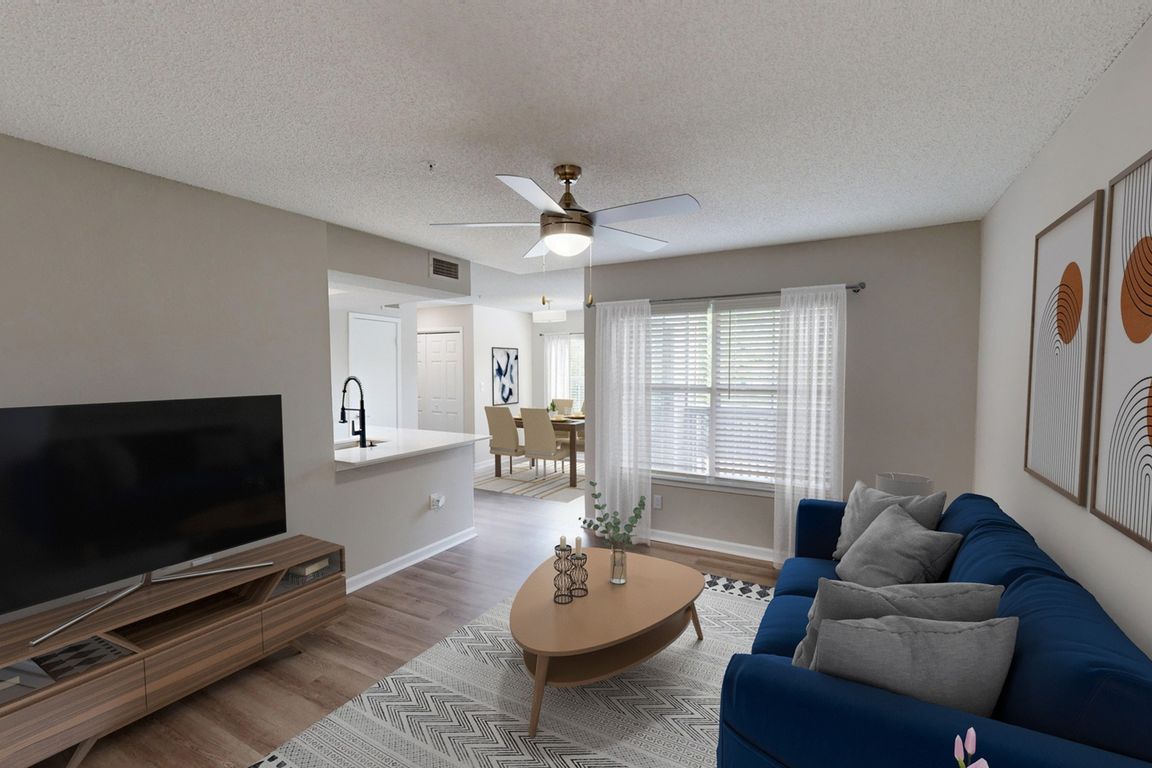 Newly Renovated Living Room wiith Gorgeous Hardwood-Style Flooring