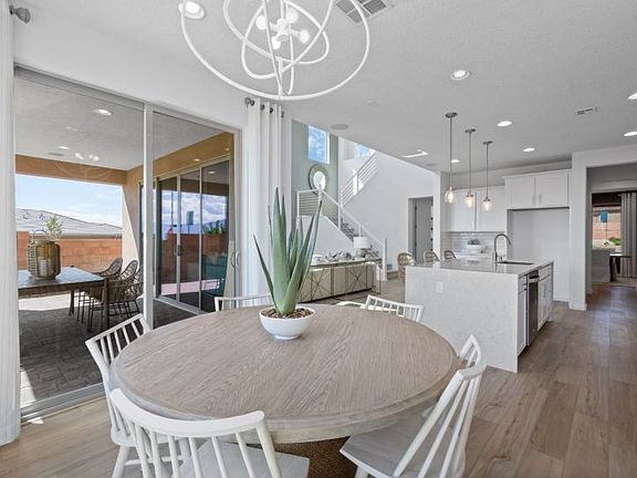 Cafe area just off the kitchen has a sliding glass door leading to the covered patio.