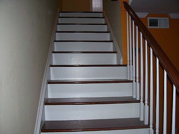 View of the stairs w/hardwood to the second level