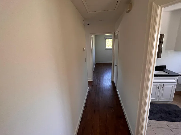 Hallway to Kitchen, Living Room, and Bedroom