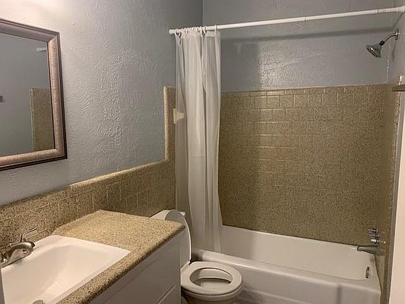 Bathroom with updated mirror and light fixtures