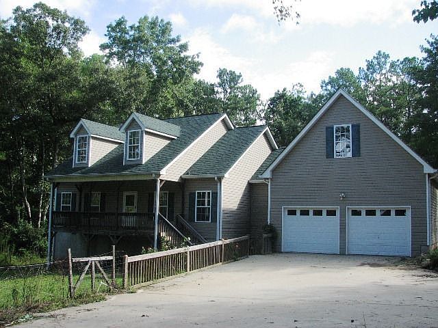 Custom ranch style home on a couple of acres. Peace and quiet abound. Freshly painted and carpeted i