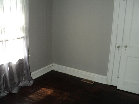 Bedroom with wood floor (view 1)