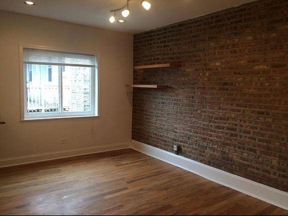 Cute shelves and exposed brick!