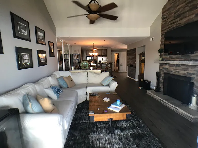Great Room with Vaulted Ceilings and Beautiful Stone Fireplace