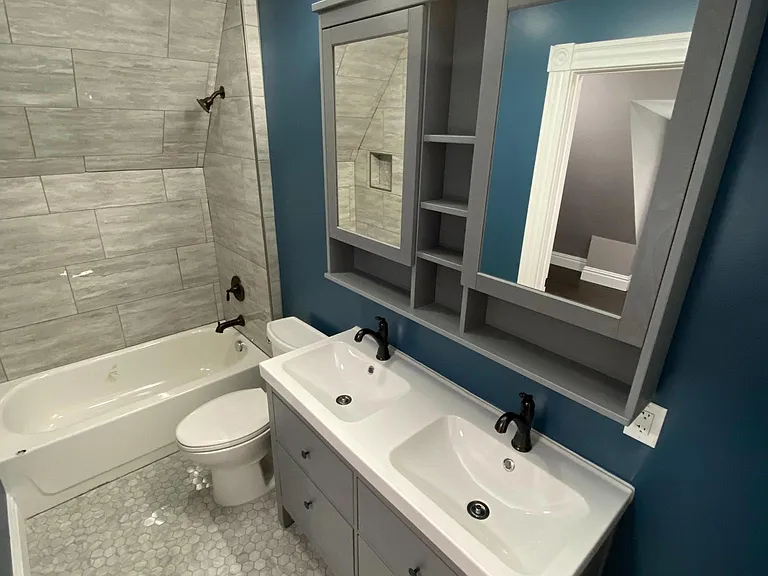 3rd floor bathroom! Glitzy modern tiled floor and shower with double bowl sinks!
