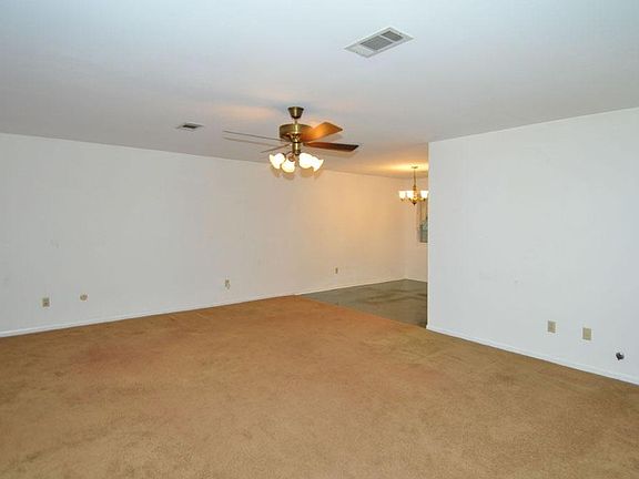 HUGE living area with ceiling fan.