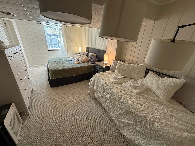 The twin daybed doubles as couch seating by day, with a trundle twin that pulls out for guests _ bedroom and sitting room in one