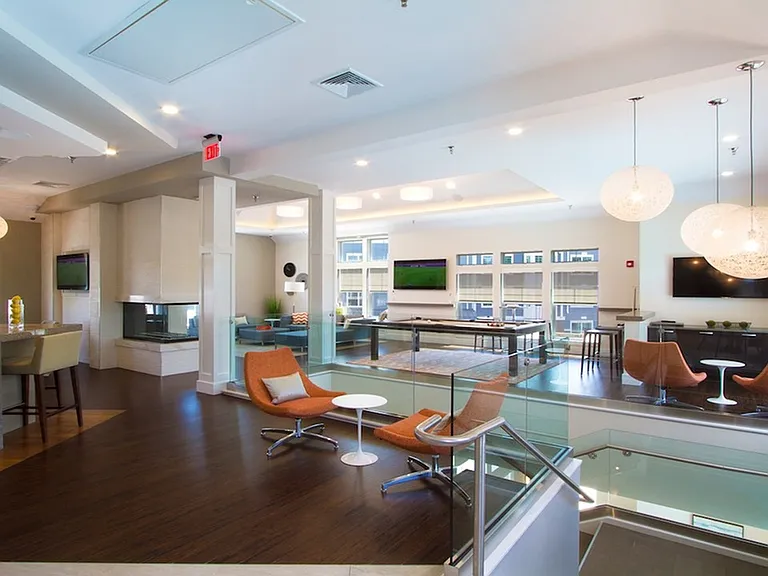 Second floor features lounge areas, gaming room, flat screens and fireplace
