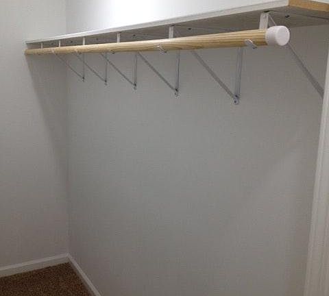 Master Closet (with large shelfs on opposite side)