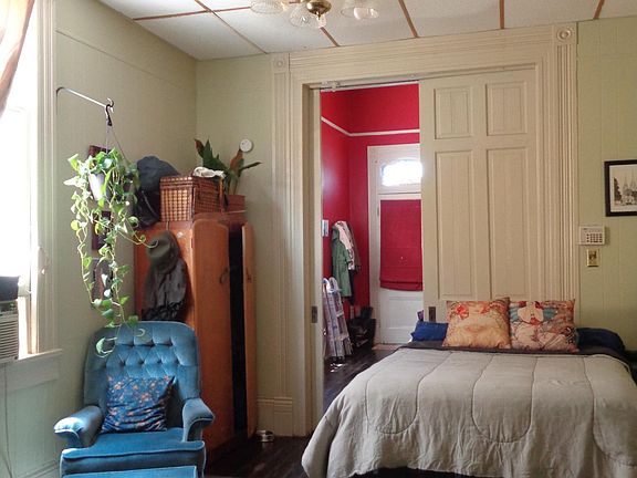 bedroom second room back separated from the first room by pocket doors.