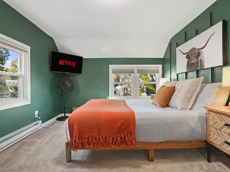 Queen bed, 40" smart TV, dedicated workspace, closet storage, black out blinds.