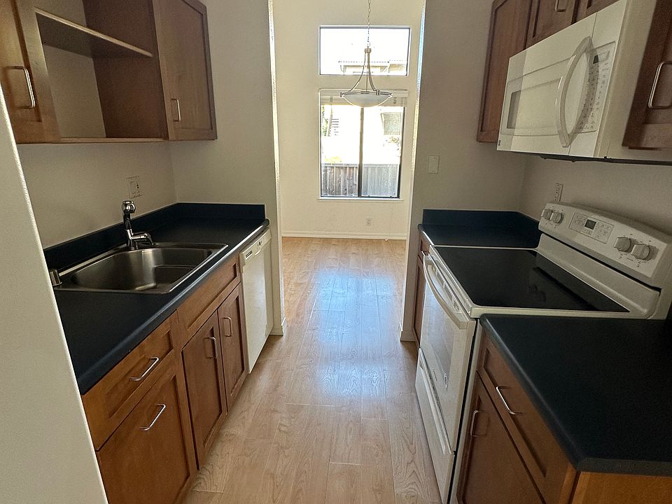Electric ceramic stove/oven and all appliances. Kitchen cabinets have optional child safety locks.