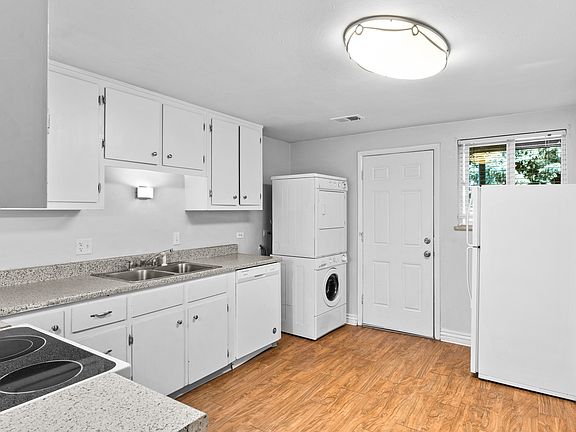 Nice Kitchen with Washer and Dryer in unit, Dishwasher and Fridge with a door to your back patio.