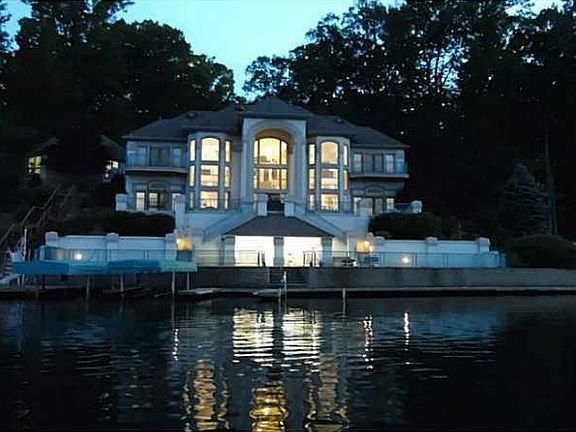 Exterior Front. Night picture of exterior picture across the water.