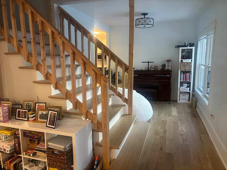 Area to right of front door as you enter.