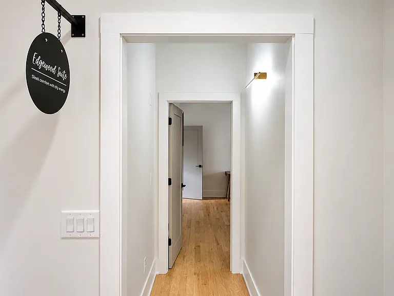 Get the best sleep in this queen bedroom with plush bedding, blackout curtains, bedside charging, warm lighting, and a smart TV to binge watch your favorite shows. Relax in luxury!