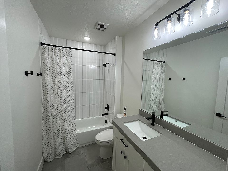Light and bright bathroom with tile surround and floor