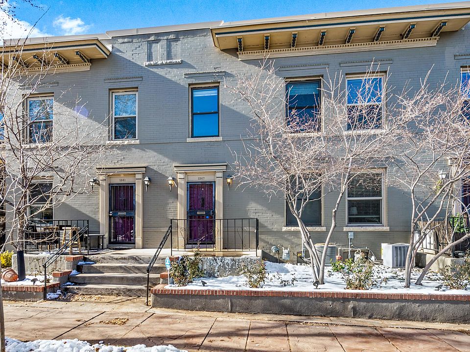 Why live in a high-rise condo when you can live in this walk-up townhome?