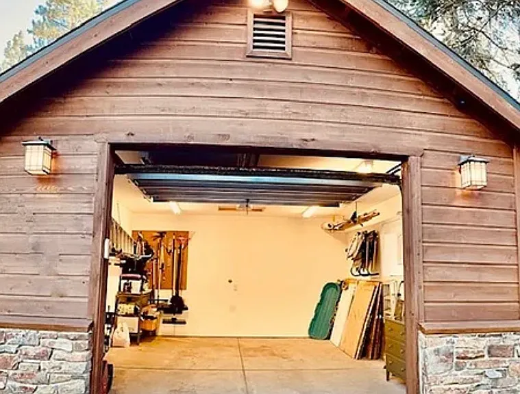 Single car garage with flat driveway and parking for 2 additional vehicles on driveway.